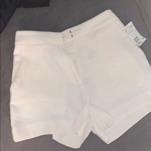 White/cream colored shorts with pockets